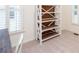 Bedroom with white bookshelf and light streaming in through the plantation shutters at 403 Hidden Hills Ct, Canton, GA 30115