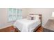 Bedroom featuring hardwood floors, natural light, and comfortable furnishings at 403 Hidden Hills Ct, Canton, GA 30115