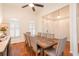 Elegant dining room with a large wooden table, comfortable chairs, and ample natural light at 403 Hidden Hills Ct, Canton, GA 30115