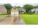 Inviting two-story home with a well-maintained lawn and a spacious driveway leading to a two-car garage at 403 Hidden Hills Ct, Canton, GA 30115