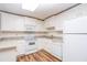 Bright kitchen featuring white cabinetry, granite countertops, and modern appliances at 403 Hidden Hills Ct, Canton, GA 30115
