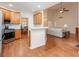 Open-concept kitchen featuring bar seating and views of the living area at 403 Hidden Hills Ct, Canton, GA 30115