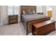 Primary bedroom featuring stylish wood furniture, including side tables and an upholstered bed at 403 Hidden Hills Ct, Canton, GA 30115