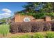 Charming brick community sign with lush landscaping at 100 Trailside Way, Hiram, GA 30141