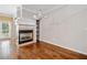 Cozy dining area showcasing a fireplace, hardwood floors, and built-in shelving at 100 Trailside Way, Hiram, GA 30141