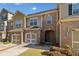 Charming brick townhome with attached garage and covered entryway at 100 Trailside Way, Hiram, GA 30141