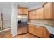 Updated kitchen with stainless steel refrigerator, granite counters, and beautiful cabinetry at 100 Trailside Way, Hiram, GA 30141