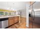 Modern kitchen with stainless steel appliances and hardwood flooring at 100 Trailside Way, Hiram, GA 30141