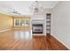 Bright living room featuring a fireplace, hardwood floors, and ample natural light at 100 Trailside Way, Hiram, GA 30141
