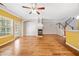Spacious living room featuring hardwood floors, fireplace, and ample natural light at 100 Trailside Way, Hiram, GA 30141