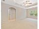 Main bedroom with carpet, tray ceiling, and plenty of natural light at 100 Trailside Way, Hiram, GA 30141
