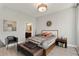 Relaxing bedroom featuring neutral tones, stylish decor, and access to an ensuite bathroom at 1080 Peachtree Ne St # 1402, Atlanta, GA 30309