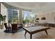 Bright common room featuring a pool table, ample seating, and large windows with city views at 1080 Peachtree Ne St # 1402, Atlanta, GA 30309