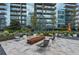 Beautiful outdoor seating with a fire pit and lush landscaping at 1080 Peachtree Ne St # 1402, Atlanta, GA 30309