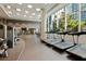 Well-equipped fitness center with treadmills, weights, and mirrored walls, offering a complete workout experience at 1080 Peachtree Ne St # 1402, Atlanta, GA 30309