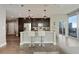 Modern kitchen featuring a breakfast bar, stainless steel appliances, and an adjacent city view balcony at 1080 Peachtree Ne St # 1402, Atlanta, GA 30309