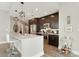 Modern kitchen featuring dark wood cabinets, stainless steel appliances, and a center island with bar seating at 1080 Peachtree Ne St # 1402, Atlanta, GA 30309