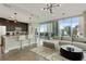 Open-concept living area with a kitchen island, floor-to-ceiling windows, and expansive city views at 1080 Peachtree Ne St # 1402, Atlanta, GA 30309