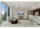 Open floor plan with city views, connecting living, kitchen, and dining areas with modern decor at 1080 Peachtree Ne St # 1402, Atlanta, GA 30309