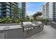 Modern outdoor kitchen area with stainless steel grills, sink, and countertop, perfect for entertaining guests at 1080 Peachtree Ne St # 1402, Atlanta, GA 30309