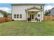 Backyard with a covered patio, fenced yard, and grass at 16 Dovecrest Way, Acworth, GA 30101