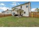 Backyard with a covered patio, fenced yard, and grass at 16 Dovecrest Way, Acworth, GA 30101