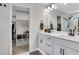 Stylish bathroom features a walk in closet, dual vanity with modern fixtures, and a shower at 16 Dovecrest Way, Acworth, GA 30101