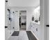 Modern bathroom featuring a tiled shower, dual vanities, and ample cabinet space for storage at 16 Dovecrest Way, Acworth, GA 30101