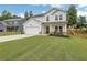Well-maintained home with a neat lawn, complemented by a charming covered porch and a two-car garage at 16 Dovecrest Way, Acworth, GA 30101