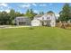Beautiful home featuring a well-manicured lawn and landscaping, complementing the house's inviting curb appeal at 16 Dovecrest Way, Acworth, GA 30101