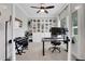 Bright office with a built-in bookshelf and ample lighting, complete with modern desk and comfortable seating at 16 Dovecrest Way, Acworth, GA 30101