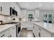 Gourmet kitchen features stainless steel appliances, a gas cooktop, and an expansive island for food preparation at 16 Dovecrest Way, Acworth, GA 30101