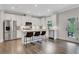 Modern kitchen featuring stainless steel appliances, a center island with seating, and access to the backyard at 16 Dovecrest Way, Acworth, GA 30101
