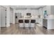 Stylish kitchen featuring white cabinets, stainless appliances, central island with seating, and modern finishes at 16 Dovecrest Way, Acworth, GA 30101