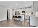 Elegant kitchen features an island with seating, stainless steel appliances, and ample countertop space at 16 Dovecrest Way, Acworth, GA 30101