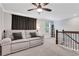 Spacious living room with carpet, ceiling fan, and comfortable seating for relaxing and entertaining at 16 Dovecrest Way, Acworth, GA 30101