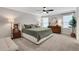 This main bedroom features carpet, a ceiling fan, and coordinated furnishings for comfort and style at 16 Dovecrest Way, Acworth, GA 30101