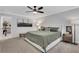 Relax in this main bedroom featuring carpet, a ceiling fan, and coordinated furnishings at 16 Dovecrest Way, Acworth, GA 30101
