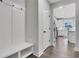 Mud room/hallway leading to the kitchen, featuring a bench and storage space and access to the kitchen at 16 Dovecrest Way, Acworth, GA 30101