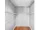 Walk-in closet with white wire shelving and hardwood flooring at 2201 Colonial Oak Way, Stone Mountain, GA 30087