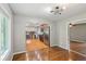 Dining area showcasing wood floors and views into the kitchen and other living areas at 2201 Colonial Oak Way, Stone Mountain, GA 30087