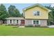 Charming two-story home with a brick facade and a well-manicured front lawn at 2201 Colonial Oak Way, Stone Mountain, GA 30087