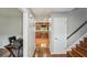 Hallway leads to a kitchen area, stairs to the right, and a door to the right at 2201 Colonial Oak Way, Stone Mountain, GA 30087