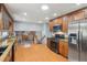 Modern kitchen equipped with stainless steel appliances and granite countertops with an open layout at 2201 Colonial Oak Way, Stone Mountain, GA 30087