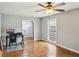 Well lit living room with hardwood floors and a ceiling fan at 2201 Colonial Oak Way, Stone Mountain, GA 30087