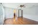 Large main bedroom with hardwood floors, ceiling fan, and convenient access to the bathroom at 2201 Colonial Oak Way, Stone Mountain, GA 30087