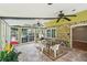 Bright sun room featuring tiled floor, ceiling fans and light-filled windows at 2201 Colonial Oak Way, Stone Mountain, GA 30087