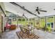 Enclosed sunroom with lots of natural light from windows, ceiling fans, and tile floors at 2201 Colonial Oak Way, Stone Mountain, GA 30087