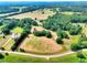 Aerial view of the acreage with property lines, trees, and a road at 259 Hwy 11, Social Circle, GA 30025
