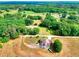 Aerial view of lovely home with surrounding acreage, and views of green space at 259 Hwy 11, Social Circle, GA 30025